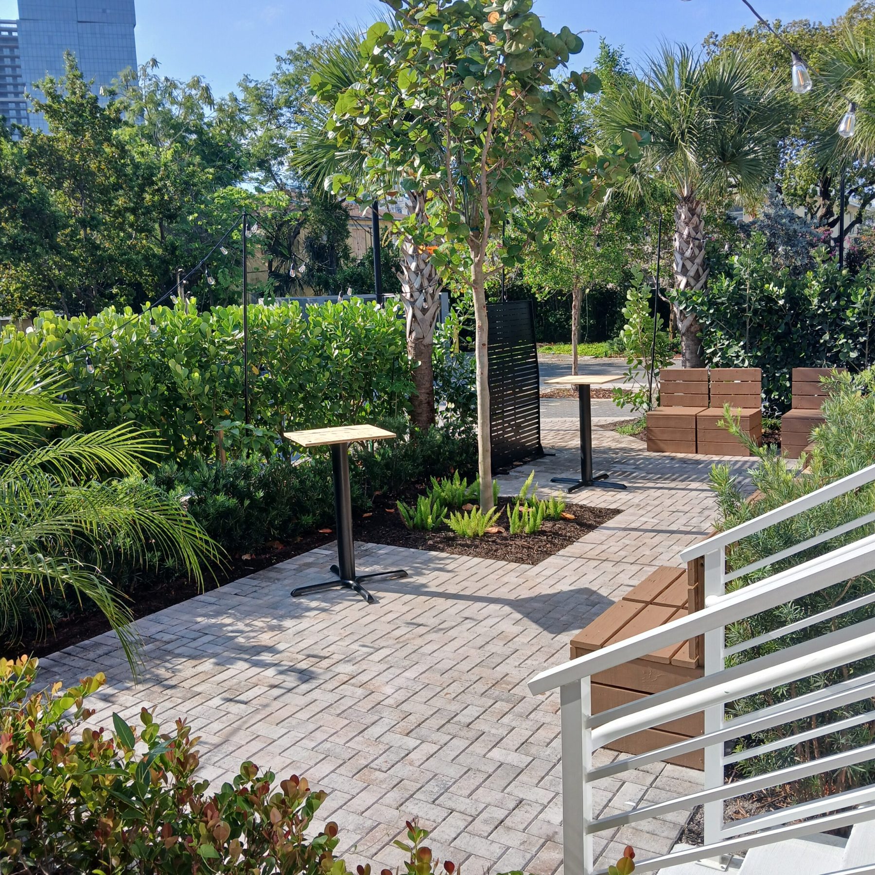 Garden walkway with cocktail tables